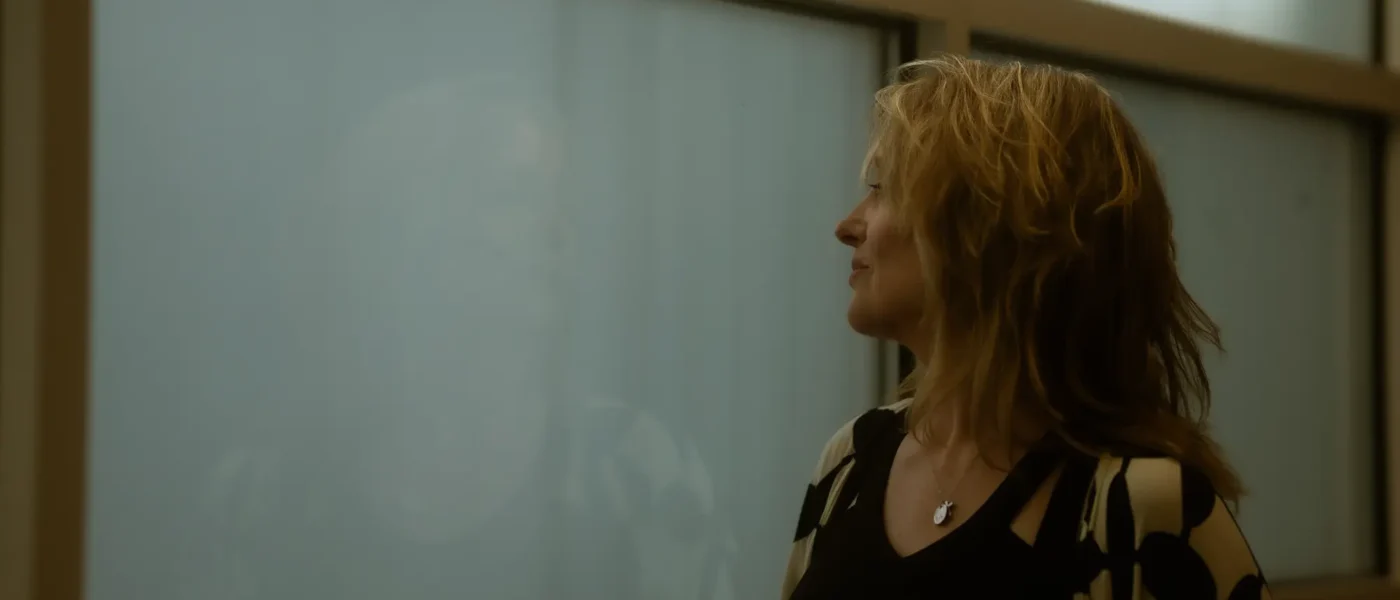 Janet Planet looking out a window